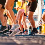 Group of runners participating in a city marathon during daylight.